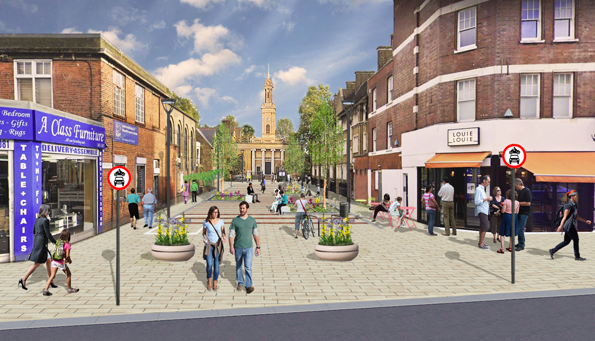 Updated design from Walworth Road showing new paving, a car-free environment using camera-enforcement to allow access for emergency services, a more linear design with greenery, planting and seating, more space for local businesses, and a loading bay.